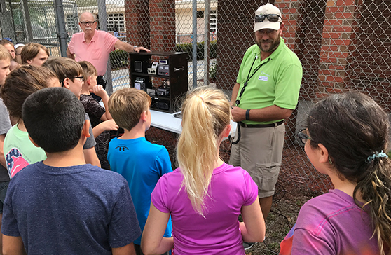 ARISS students practice using the radio equipment