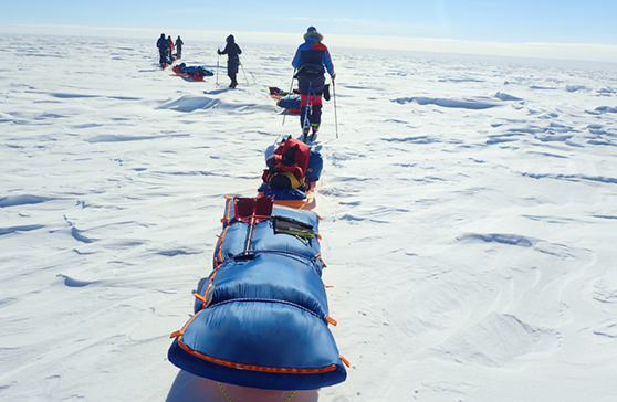 Dragging a slegde across the ice Dragging a slegde across the ice